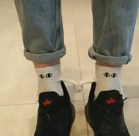 Hand Holding Socks